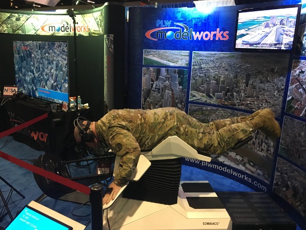 Person using virtual reality simulator while flying through PLW models
